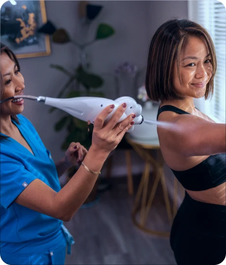 Practitioner applying localized cryotherapy to a client’s shoulder